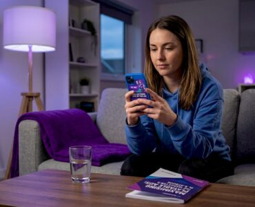 Woman pausing game to view mobile ad
