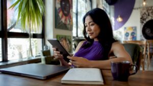 Marketer reviewing no-code ad campaigns on tablet