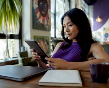 Marketer reviewing no-code ad campaigns on tablet