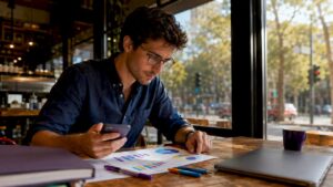 Professional reviewing mobile ad campaign report