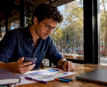 Professional reviewing mobile ad campaign report