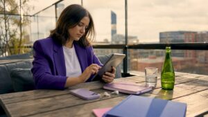 Marketer working on mobile ad design tablet