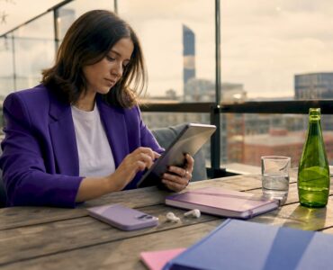 Marketer working on mobile ad design tablet