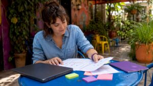 Creative manager reviewing checklist papers in office